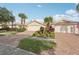 Charming home featuring a brick driveway, two-car garage, and a well-manicured lawn at 7632 Quinto Dr, Sarasota, FL 34238