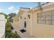 Charming home's front entrance featuring white columns and a decorative glass front door at 7632 Quinto Dr, Sarasota, FL 34238