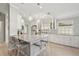 This kitchen features pendant lighting, an island with seating and stainless steel appliances at 7632 Quinto Dr, Sarasota, FL 34238