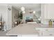 Kitchen island with seating and an open view into the living room at 7632 Quinto Dr, Sarasota, FL 34238