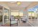 Bright lanai with comfortable seating, perfect for relaxing outdoors and enjoying backyard views at 7632 Quinto Dr, Sarasota, FL 34238