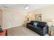 Comfortable living room with a dark sofa and neutral walls, perfect for relaxing and enjoying quiet moments at 7632 Quinto Dr, Sarasota, FL 34238