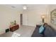The living room offers a comfortable blue sofa and a vintage wooden chest at 7632 Quinto Dr, Sarasota, FL 34238