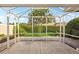 The patio has views of a well-manicured lawn and hedges, creating a peaceful outdoor space at 7632 Quinto Dr, Sarasota, FL 34238