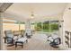 Enclosed patio with a ceiling fan and garden views providing a comfortable outdoor relaxation area at 7632 Quinto Dr, Sarasota, FL 34238