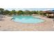 Large, inviting community pool with ample seating and a tiki bar, perfect for relaxation and entertainment at 7632 Quinto Dr, Sarasota, FL 34238