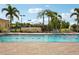Sparkling swimming pool with brick patio and comfortable lounge chairs at 7632 Quinto Dr, Sarasota, FL 34238