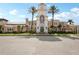 Beautiful town center with clock tower, palm trees, and inviting architecture at 7632 Quinto Dr, Sarasota, FL 34238