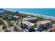 Aerial view of a condo community, showcasing beach access and carport parking at 8779 Midnight Pass Rd # 506H, Sarasota, FL 34242