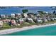 Aerial view of beachfront condos with pools and ocean views on a sunny day at 8779 Midnight Pass Rd # 506H, Sarasota, FL 34242