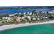 Stunning aerial view of beachfront condos with a pool and Gulf access at 8779 Midnight Pass Rd # 506H, Sarasota, FL 34242
