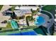 Aerial view of the community shuffleboard, pool, and tennis courts at 8779 Midnight Pass Rd # 506H, Sarasota, FL 34242