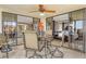 This cozy screened balcony has water views and a ceiling fan above the dining table at 8779 Midnight Pass Rd # 506H, Sarasota, FL 34242