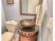Unique bathroom vanity with an eye-catching bowl sink and decorative cabinet at 8779 Midnight Pass Rd # 506H, Sarasota, FL 34242