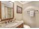 Bathroom featuring granite countertops, wood cabinets and updated fixtures at 8779 Midnight Pass Rd # 506H, Sarasota, FL 34242