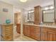 This bathroom features double sinks, updated vanities, and a tiled walk-in shower at 8779 Midnight Pass Rd # 506H, Sarasota, FL 34242