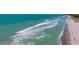 Expansive beach view featuring turquoise water and pristine sands at 8779 Midnight Pass Rd # 506H, Sarasota, FL 34242