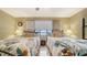 Serene bedroom with two beds and view, offering comfort and style at 8779 Midnight Pass Rd # 506H, Sarasota, FL 34242