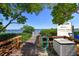 Picturesque waterfront view of a dock with lush greenery and serene water, offering a tranquil retreat at 8779 Midnight Pass Rd # 506H, Sarasota, FL 34242