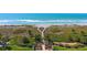 A sandy path leads to a beautiful oceanfront view at 8779 Midnight Pass Rd # 506H, Sarasota, FL 34242