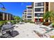 Community patio with lounge chairs and grilling area offers residents a space to relax and socialize at 8779 Midnight Pass Rd # 506H, Sarasota, FL 34242