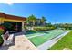 Enjoy an active lifestyle with community shuffleboard courts surrounded by lush landscaping at 8779 Midnight Pass Rd # 506H, Sarasota, FL 34242