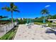Enjoy a game of tennis in the community courts surrounded by lush landscaping and seating areas at 8779 Midnight Pass Rd # 506H, Sarasota, FL 34242