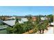 Picturesque water view showcasing nearby houses and the ocean horizon under a clear blue sky at 8779 Midnight Pass Rd # 506H, Sarasota, FL 34242