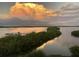Picturesque water view featuring lush greenery and vibrant sky, ideal for tranquil living at 8779 Midnight Pass Rd # 506H, Sarasota, FL 34242