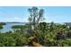 Enjoy wide water views from this property surrounded by lush tropical landscaping at 8779 Midnight Pass Rd # 506H, Sarasota, FL 34242