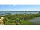 Enjoy panoramic water views from this property surrounded by lush tropical landscaping at 8779 Midnight Pass Rd # 506H, Sarasota, FL 34242