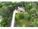 Aerial view of house surrounded by mature landscaping at 950 Trotter St, Nokomis, FL 34275