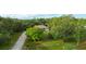 Aerial perspective highlighting the home's setting amidst lush greenery and spacious grounds at 950 Trotter St, Nokomis, FL 34275