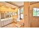 Spacious bathroom with dual sinks, soaking tub, and separate tiled shower at 950 Trotter St, Nokomis, FL 34275