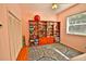 Bedroom with a built-in bookshelf and a closet at 950 Trotter St, Nokomis, FL 34275