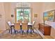 Dining area featuring an elegant light fixture and a large window at 950 Trotter St, Nokomis, FL 34275