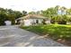 Exterior shot of a single Gathering home with attached garage and well-kept landscaping at 950 Trotter St, Nokomis, FL 34275