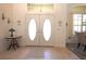 Bright foyer featuring tile flooring, a double door entry and neutral decor at 950 Trotter St, Nokomis, FL 34275