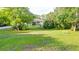 The house is surrounded by lush, mature landscaping with a long driveway at 950 Trotter St, Nokomis, FL 34275