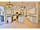Spacious kitchen with an island, stainless steel appliances, and natural light at 950 Trotter St, Nokomis, FL 34275