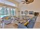 Comfortable living room with stylish furniture and access to the outdoor pool area at 950 Trotter St, Nokomis, FL 34275