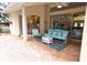 Covered patio with a seating area, a ceiling fan, and views of the surrounding yard and pool at 950 Trotter St, Nokomis, FL 34275