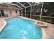 Beautiful pool and spa with brick pavers and mature landscaping at 950 Trotter St, Nokomis, FL 34275