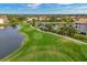 Scenic aerial view of the community golf course winding around lake and residences at 9630 Club South Cir # 6303, Sarasota, FL 34238