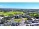 Aerial view of clubhouse, a lush golf course, and well-maintained grounds, showcasing the expansive community at 9630 Club South Cir # 6303, Sarasota, FL 34238