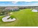 Tranquil aerial view overlooking the golf course and surrounding landscaping near the condominium at 9630 Club South Cir # 6303, Sarasota, FL 34238
