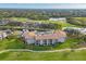 Aerial view of a residential community with views of the golf course, lakes, and meticulously maintained lawns at 9630 Club South Cir # 6303, Sarasota, FL 34238