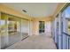 Expansive balcony with multiple sliding glass doors and neutral tile, providing scenic views and access at 9630 Club South Cir # 6303, Sarasota, FL 34238