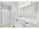 Bright bathroom with white cabinets, vanity and a large mirror at 9630 Club South Cir # 6303, Sarasota, FL 34238