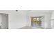 Bedroom with sliding glass doors to private balcony, and bright light from two windows at 9630 Club South Cir # 6303, Sarasota, FL 34238